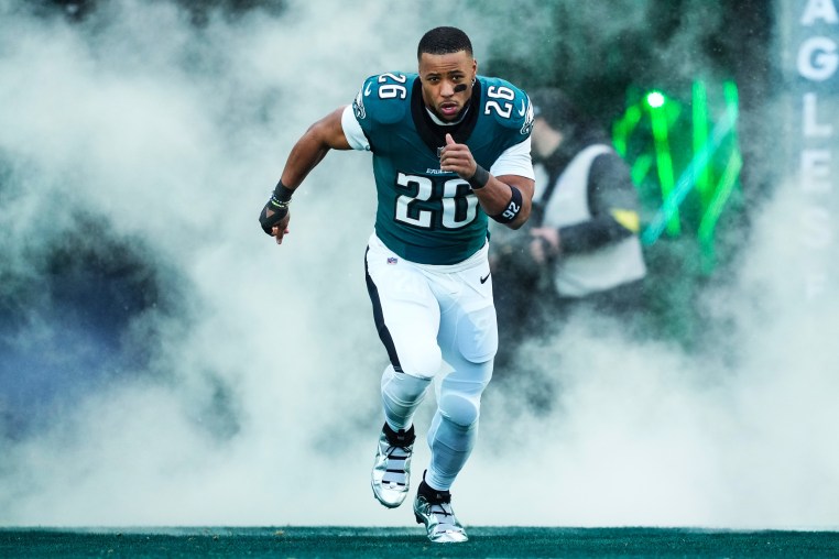 Saquon Barkley runs out of the tunnel prior to an NFL football wild card playoff game