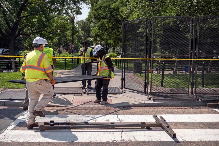 Workers put up fencing around Dupont Circle ahead of the World Pride Parade, Friday, June 6, 2025, in Washington, D.C.