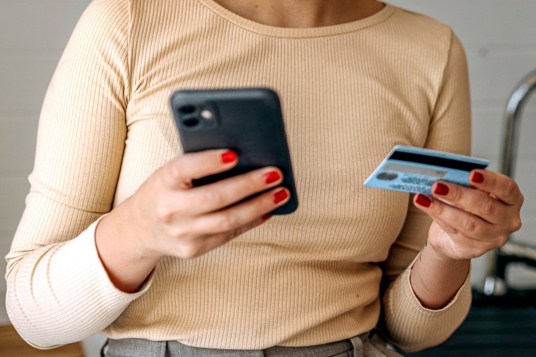 Young casually clothed woman online shopping.