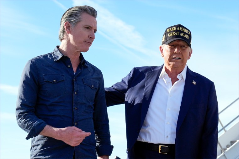 Gavin Newsom, left, and Donald Trump walk outside