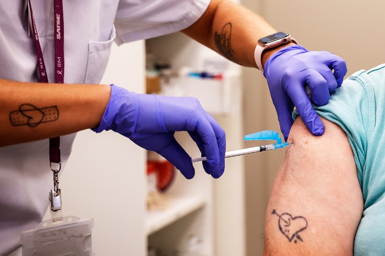 A person receives a Covid-19 vaccine