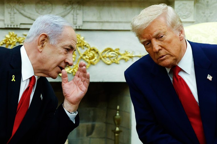 Israeli Prime Minister Benjamin talks to President Donald Trump during a meeting in the Oval Office on April 7, 2025.