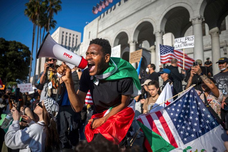 Immigration Protests Los Angeles crowd megaphone