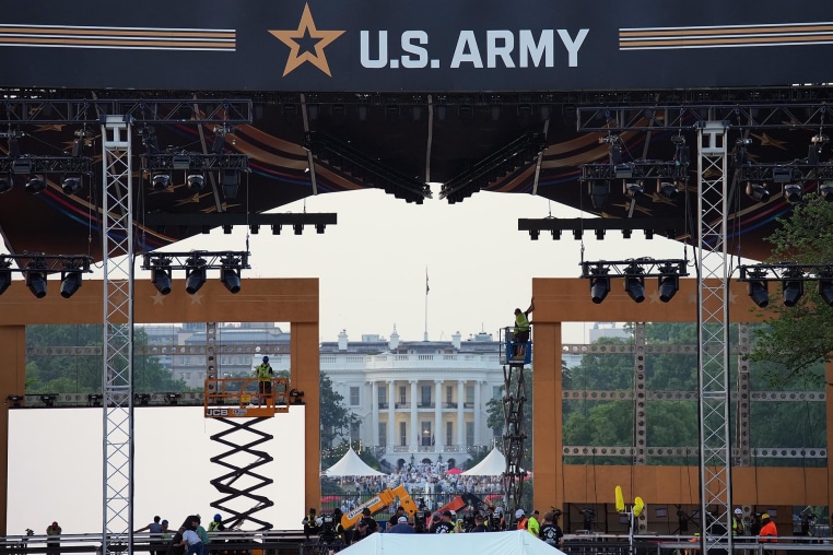 Production crews work on the stage ahead the U.S. Army's 250th Anniversary Parade on the National Mall on June 12, 2025 in Washington.