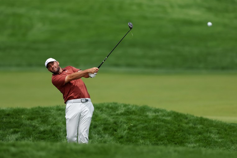 Image: Scottie Scheffler of the United States plays a shot 