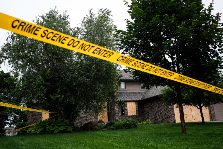 Police tape blocks off a home
