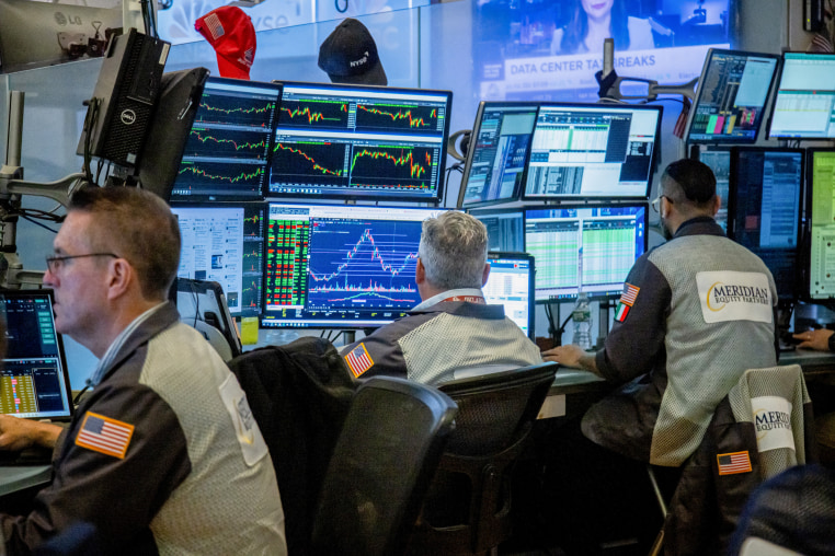 Traders work on the floor of the New York Stock Exchange.