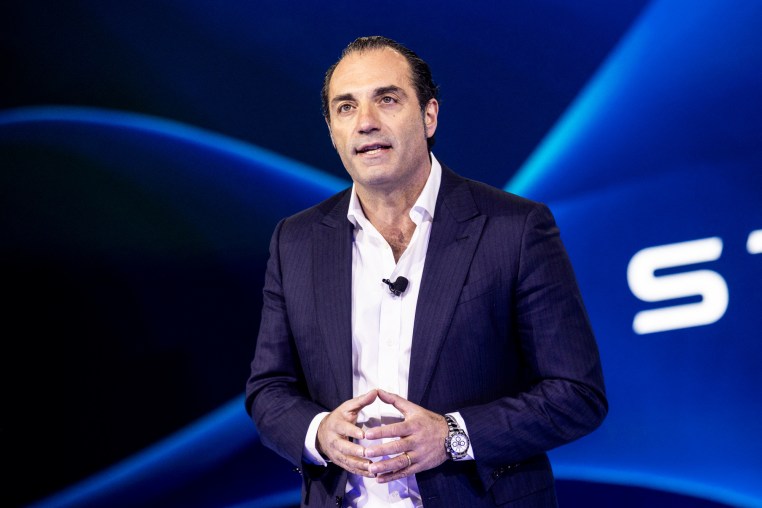 Antonio Filosa speaks while standing on stage