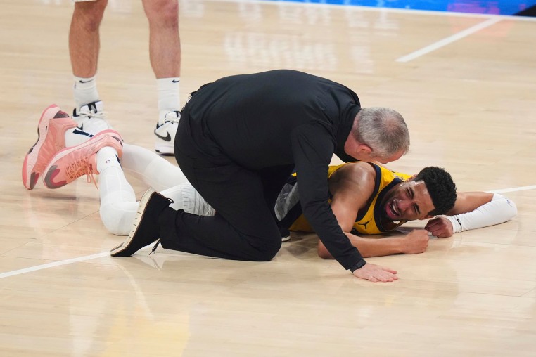 Indiana Pacers guard Tyrese Haliburton lays on the court after an injury during the first half of Game 7 of the NBA Finals basketball series against the Oklahoma City Thunder Sunday, June 22, 2025, in Oklahoma City. 