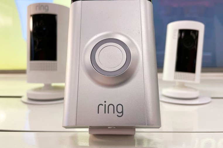 Ring security cameras are displayed on a shelf