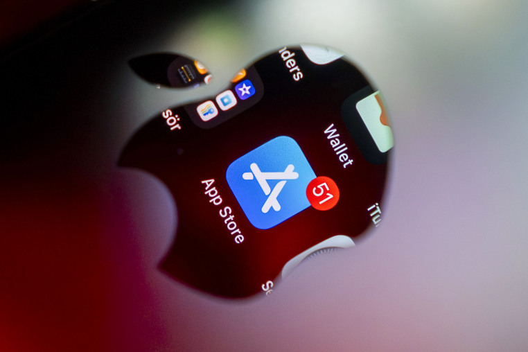 The App Store application is displayed through reflection of the Apple logo