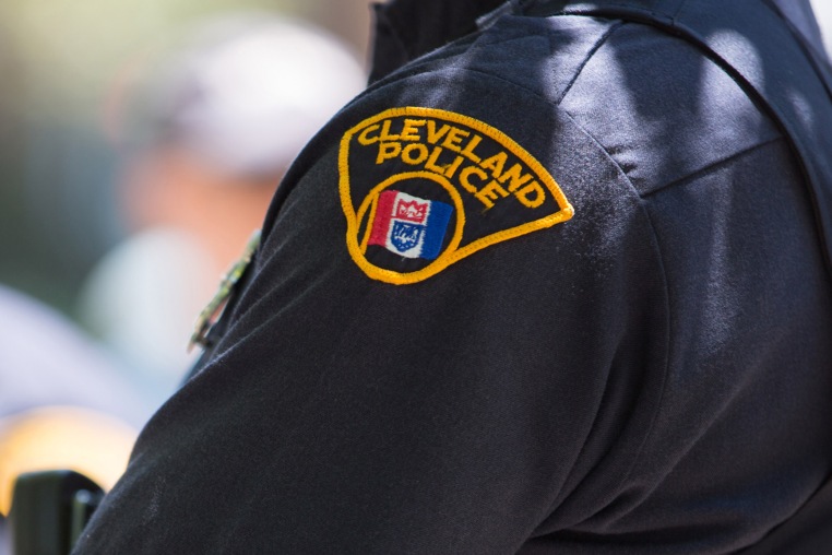 Image:  A Cleveland police officer surveys a street on May 23, 2015 in Cleveland, Ohio.