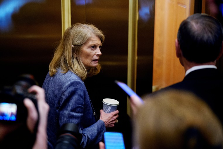 Sen. Lisa Murkowski, R-Alaska.  takes an elevator just off the Senate floor after the Senate stayed in session throughout the night at the Capitol on July 1.