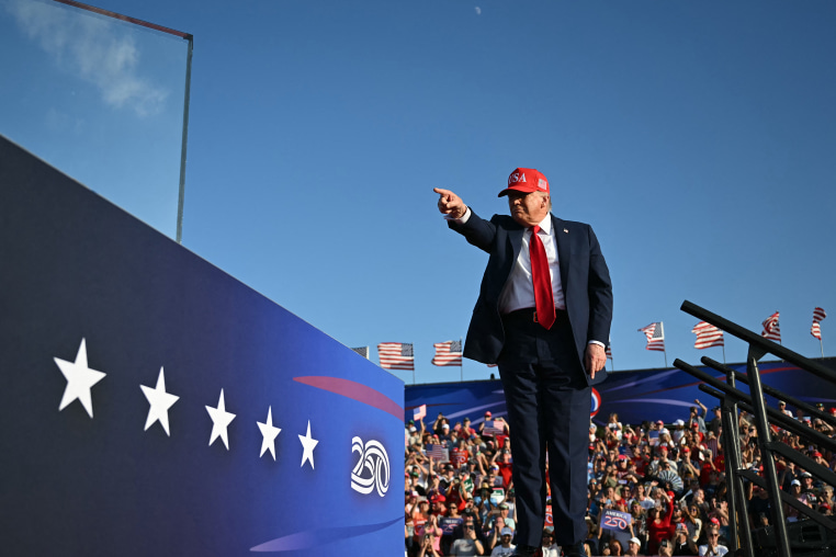 Donald Trump  pointing on stage
