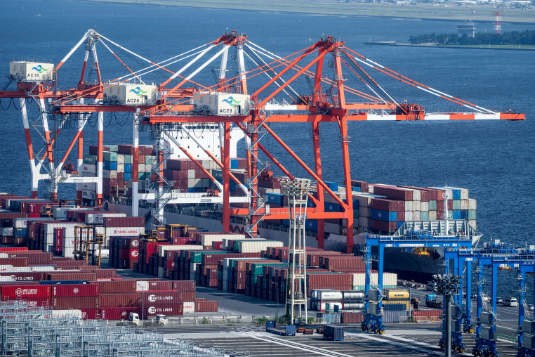 Shipping containers and a container ship at the international cargo terminal