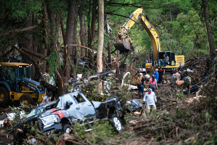 First responders carry out search and rescue operations