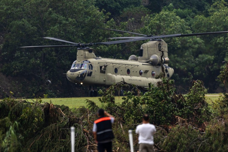 A Chinook helicopter takes off near Camp Mystic