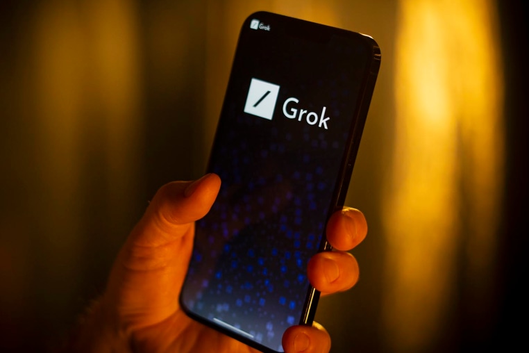 The Grok AI logo on a phone screen.