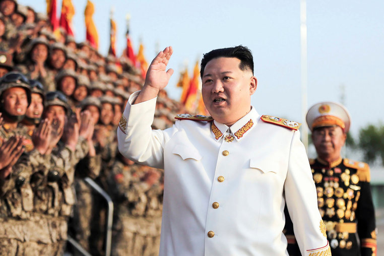 North Korean leader Kim Jong Un acknowledges the officers and soldiers who took part in a celebration the 90th founding anniversary of the Korean People's Revolutionary Army, in North Korea Wednesday, April 27, 2022.
