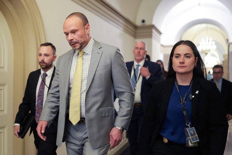 Dan Bongino walks in the Capitol.