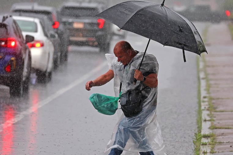 Heavy rain during morning commute floods I-93, temporarily closes part of Red Line, and prompts flash flood warnings