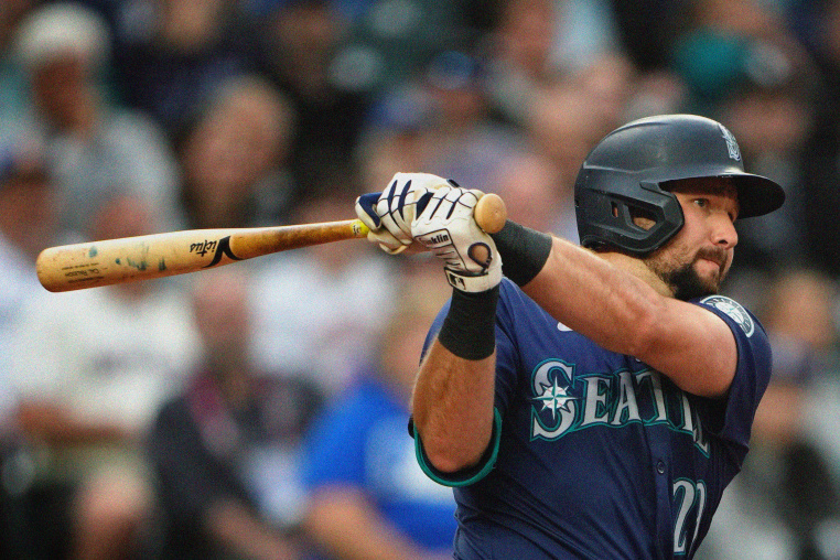 Cal Raleigh swings the bat during a Seattle Mariners game against the Chicago White Sox on June 11, 2024.