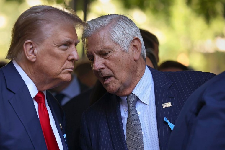 Nassau County Executive Bruce Blakeman talks to Donald Trump during a memorial ceremony on Sept. 11, 2024, in New York.