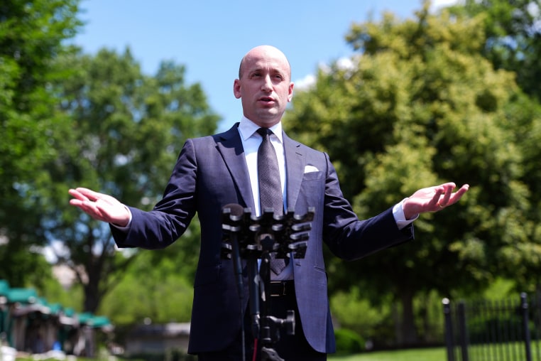 Stephen Miller speaks with reporters