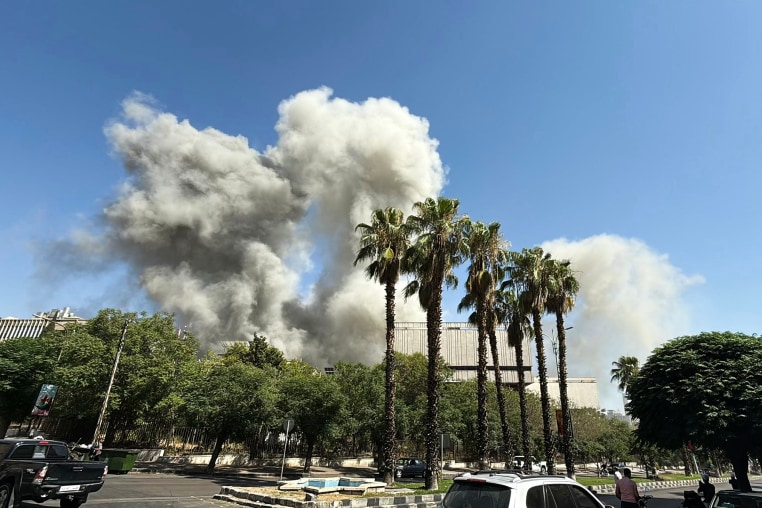 Smoke billows following Israeli strikes near the Syrian army and defence ministry headquarters in Damascus on July 16, 2025. 