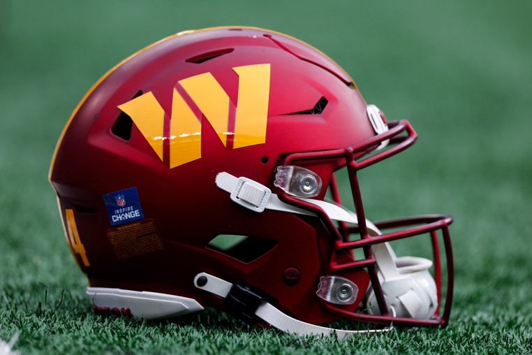 A Washington Commanders helmet on the field