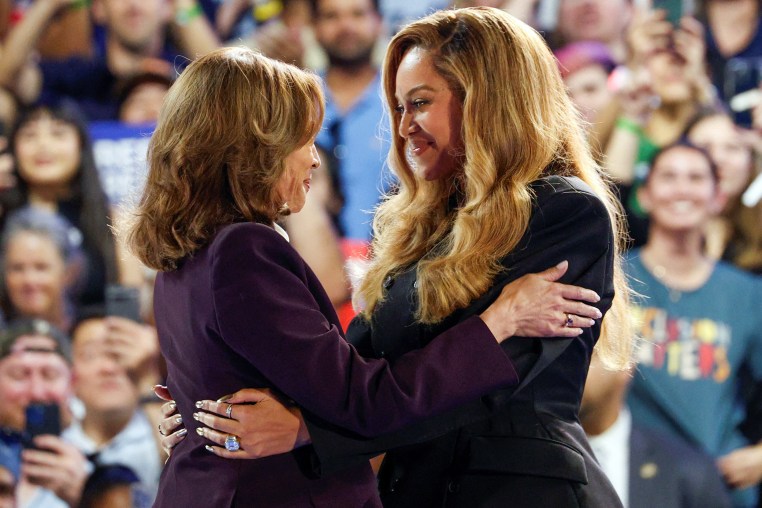 Beyonce and Kamala Harris embrace at a campaign rally.