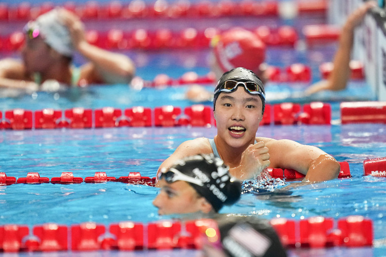 Yu Zidi in a swimming pool after the women's 200m butterfly semifinal of swimming