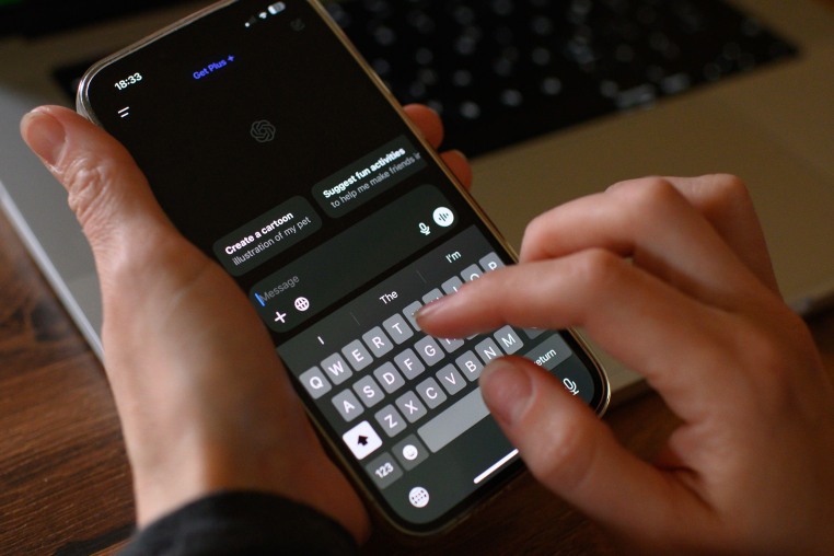 A person uses ChatGPT on their phone.