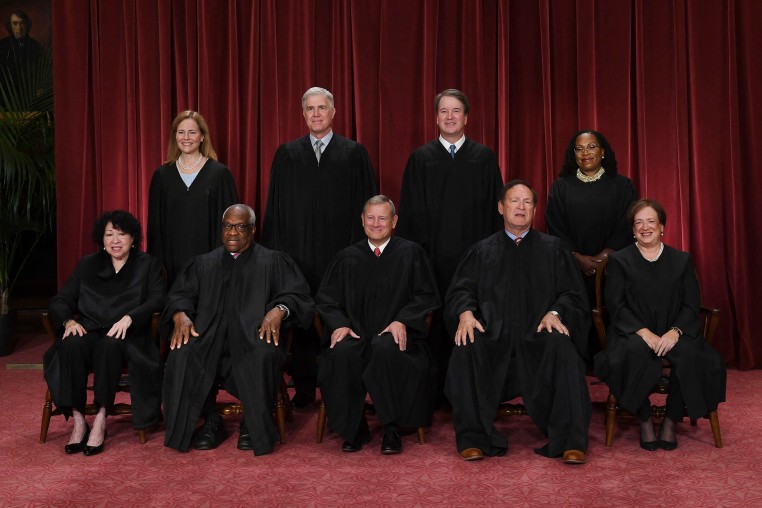 Justices of the Supreme Court pose for their official photo at the Supreme Court in Washington, DC.