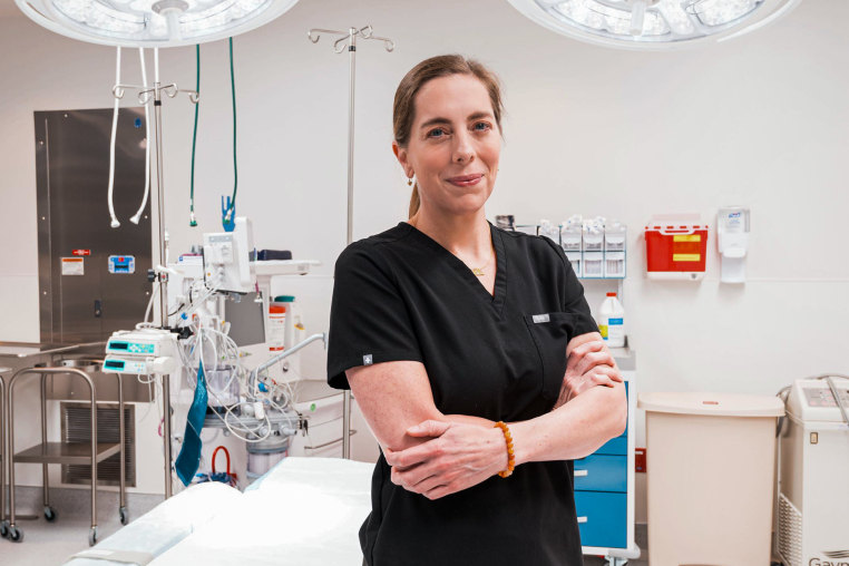 Elisabeth Potter stands in a hospital room
