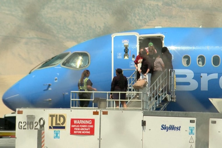 flight diverted passengers disembark plane jet breeze airways