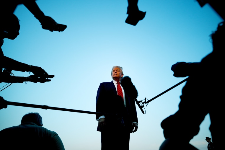 Donald Trump speaks with reporters