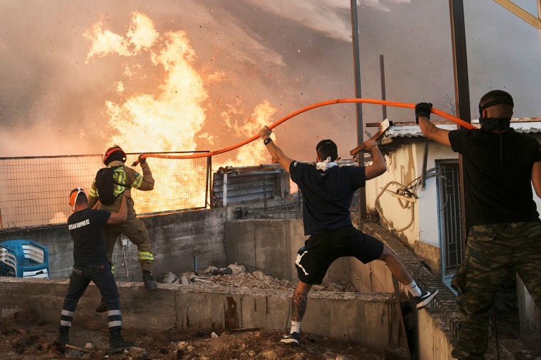 Greece Wildfires firefighter flame