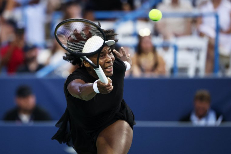 Venus Williams returns a shot