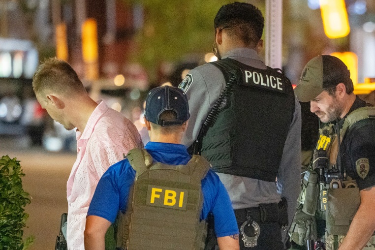 FBI and Border Patrol officers arrest a man