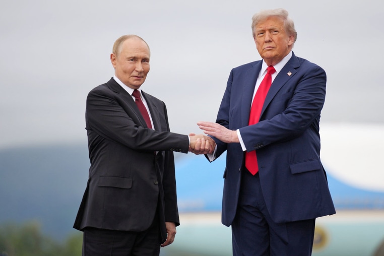 President Donald Trump greets Russian President Vladimir Putin as he arrives at Joint Base Elmendorf-Richardson on Aug. 15, 2025 in Anchorage, Alaska. 