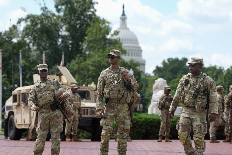Members of the National Guard stand outside Union Station on Aug. 14, 2025 in Washington, D.C. 