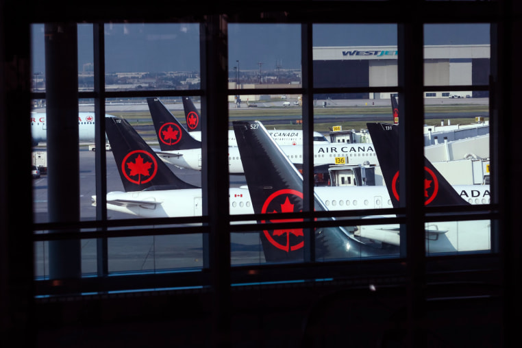 Image: Tails of Air Canada planes are seen at Pearson International Airport in Toronto, Canada.