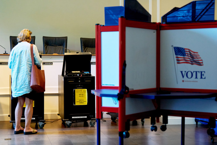 A voter casts their ballot