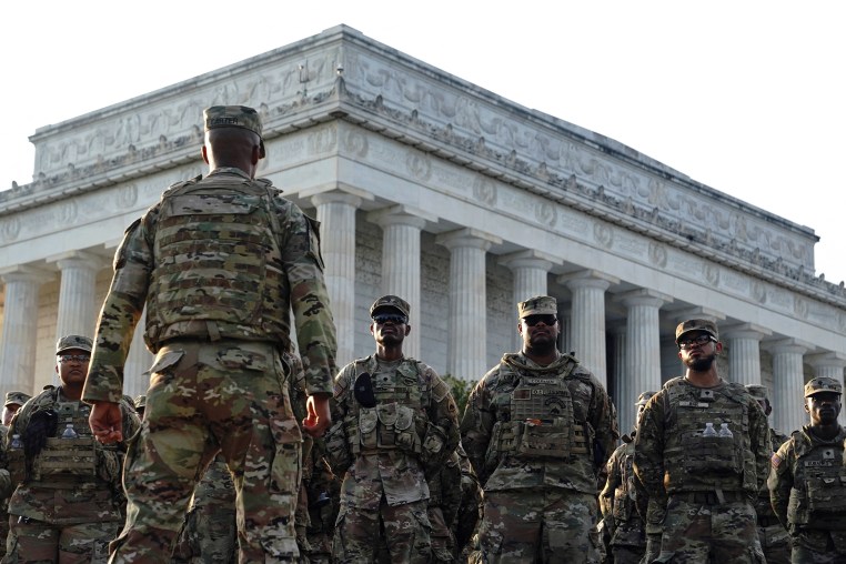 Members of the National Guard  standing at the National Mall