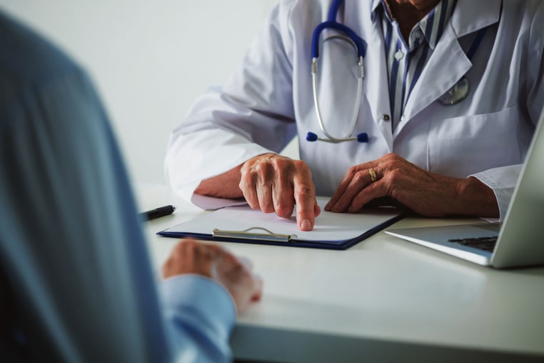 A doctor talks with a patient.