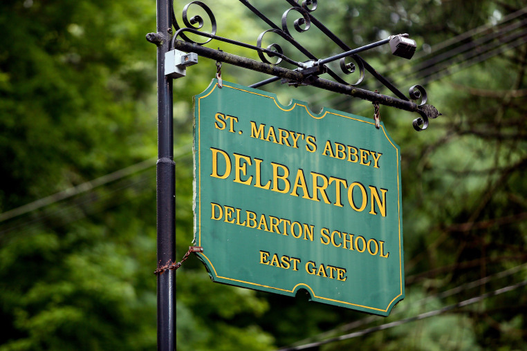 A sign that reads, "St. Mary's Abbey Delbarton School East Gate"