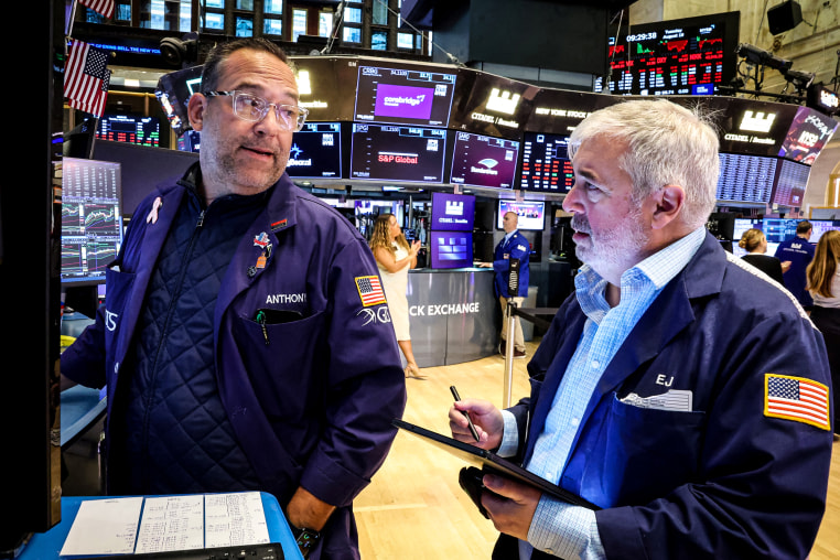 Traders work on the floor of the NYSE in New York