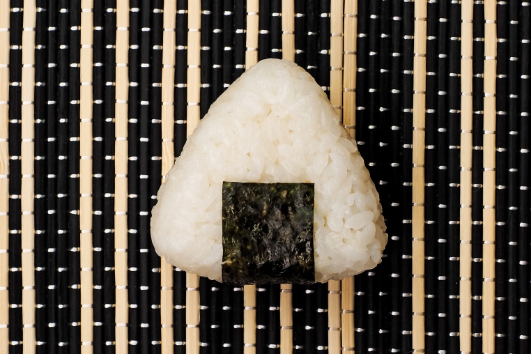 Single Onigiri. Healthy snack. Japanese rice ball. Top view.