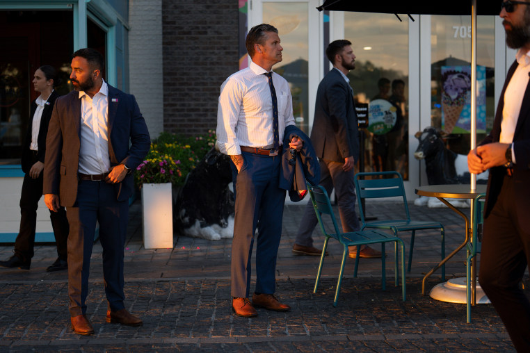 Hegseth with security.